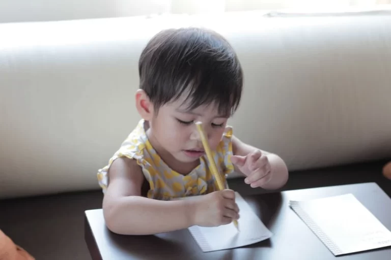 kid with dysgraphia trying to write