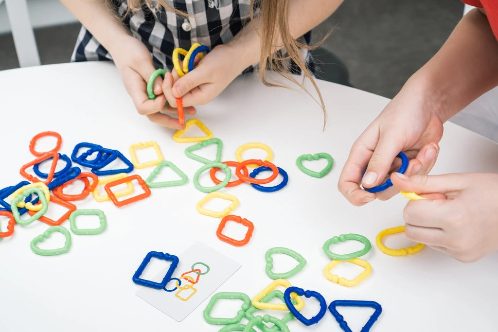 two girls with asperger syndrome playing with sensory toys