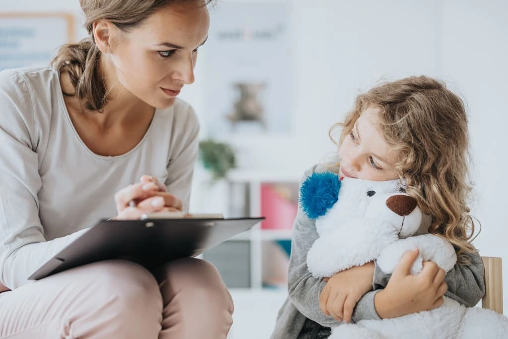 social worker lady talking to a girl