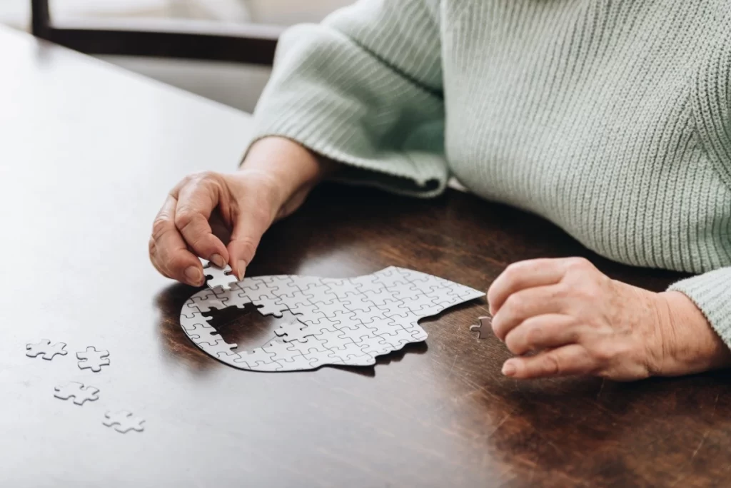 lady solving a jigsaw puzzle