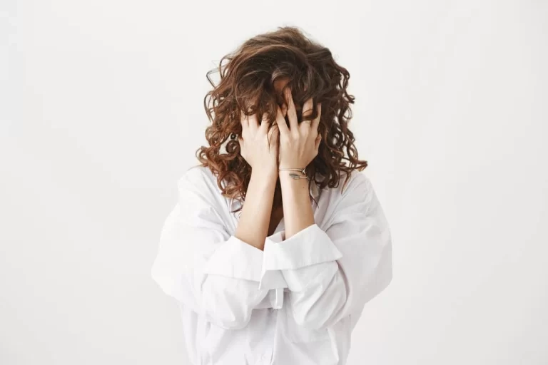 a girl hiding her face