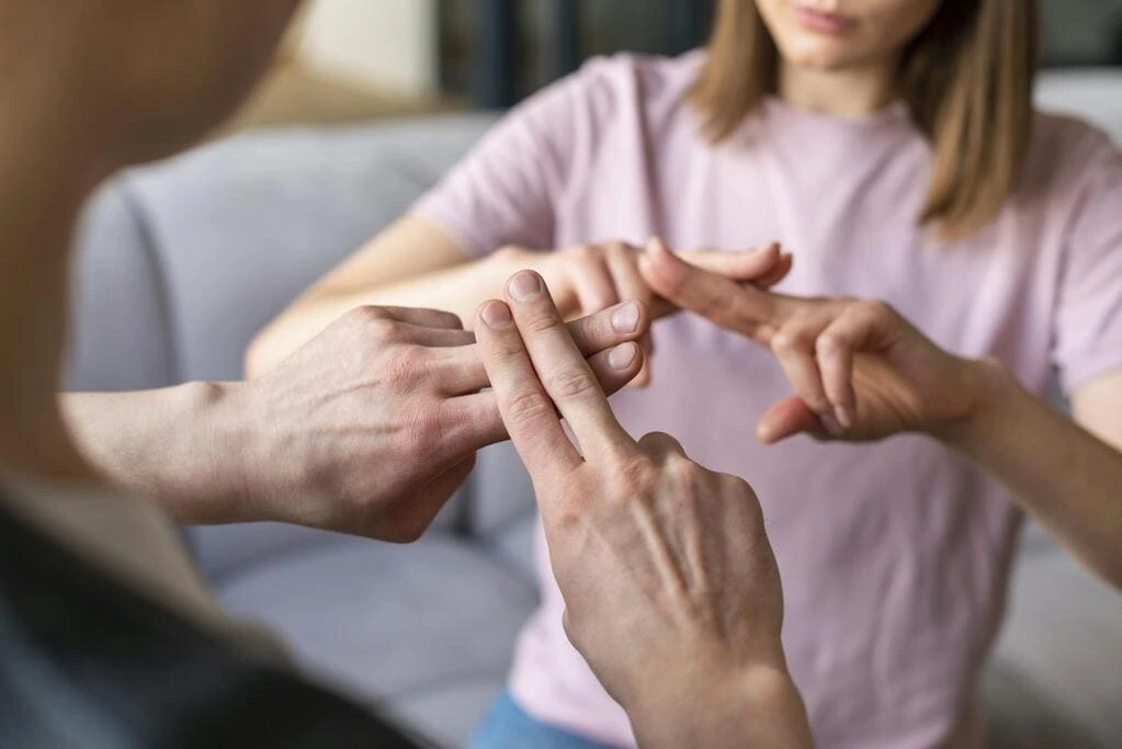 couple talking using sign language