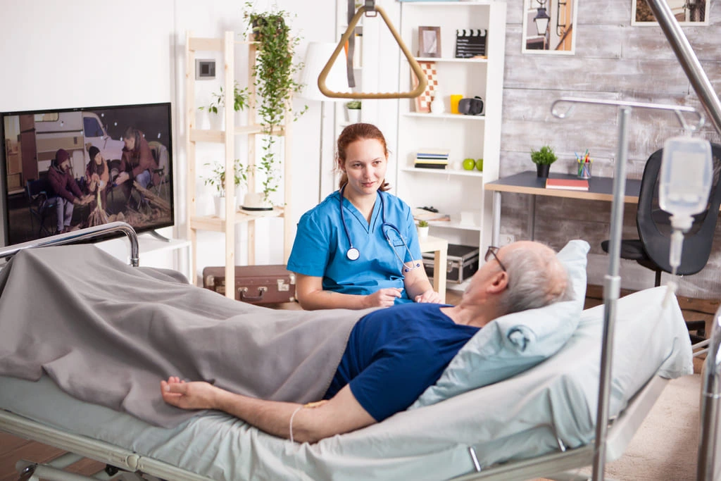 female doctor sitting beside a patient