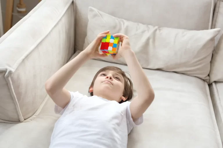 a boy playing with sensory toy