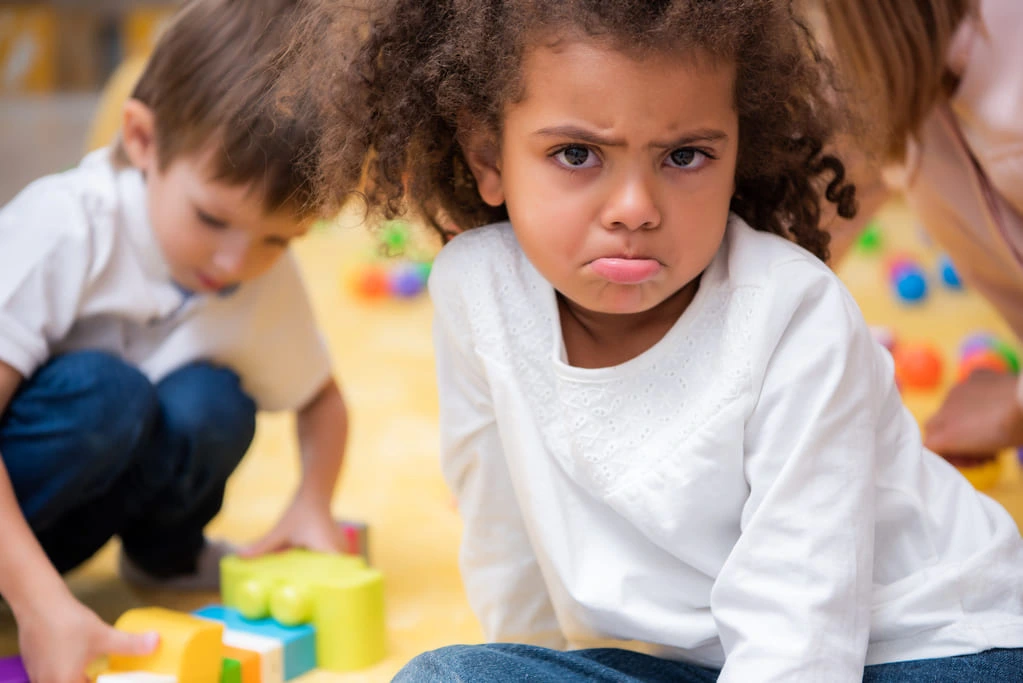 grumpy little African American girl