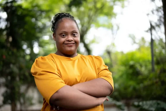 african american girl with down syndrome posing