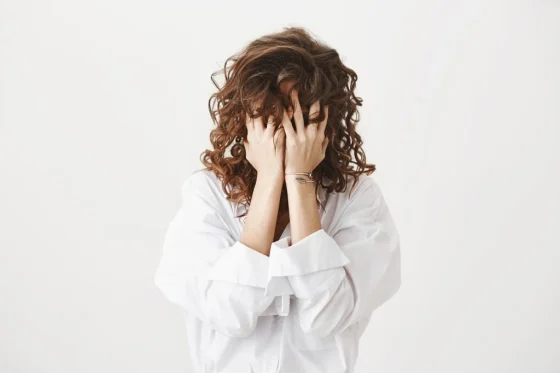 a girl hiding her face