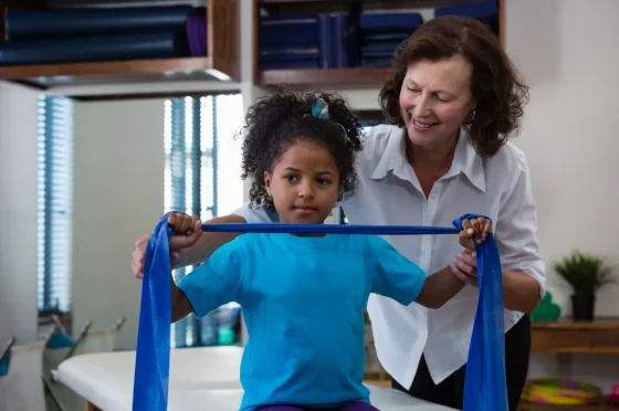 female occupational therapist working with a autistic girl
