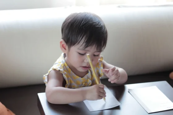 kid with dysgraphia trying to write