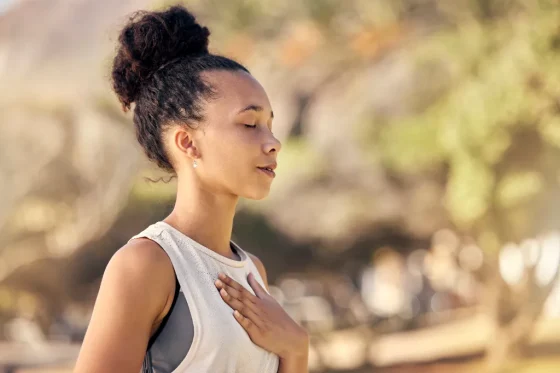 a young girl doing yoga and breathing deep