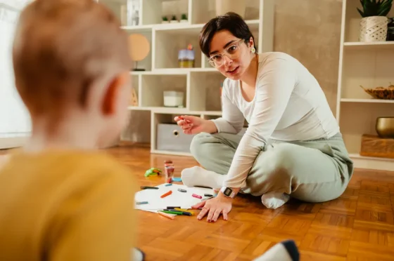 therapist working with an autistic child
