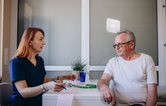 support worker with a man receiving home care