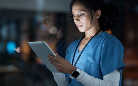 clinician with a tablet device