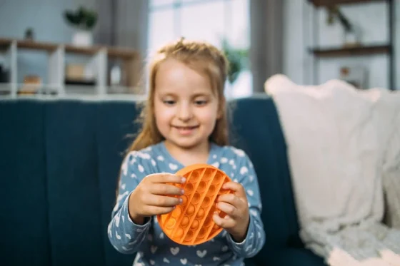 kid holding a sensory toy
