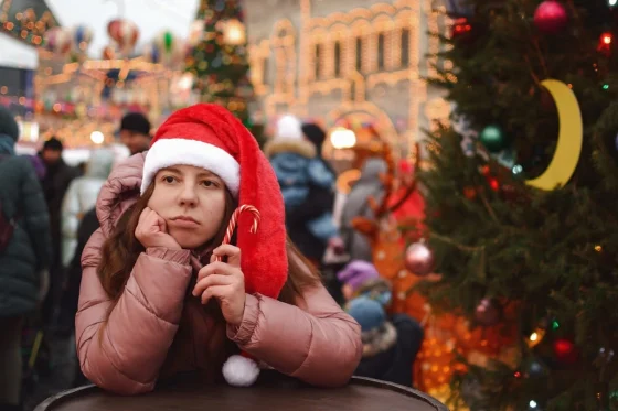 sad girl in a christmas market