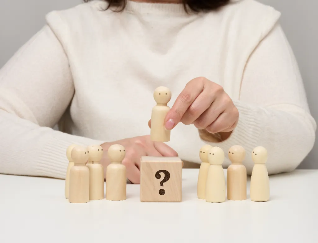 lady with wooden figures and a wooden box